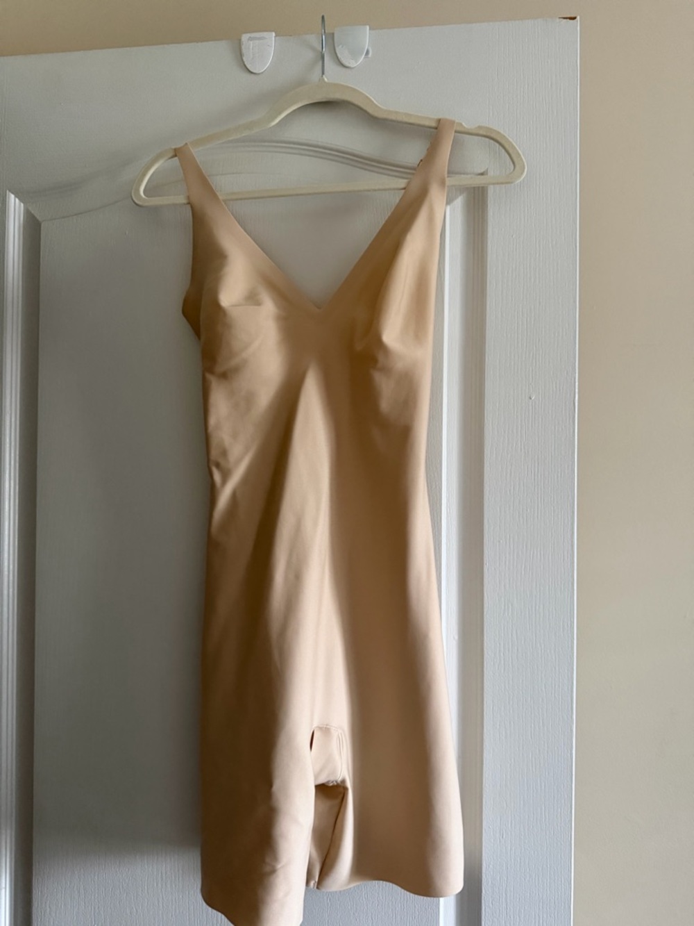 Skims body unlined blunge mid thigh bodysuit.